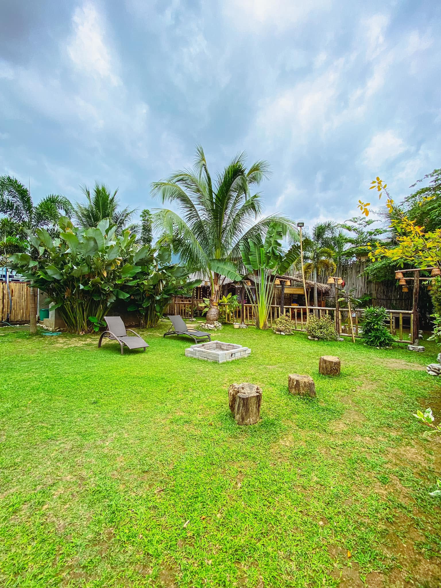 Open-air nipa dining hut surrounded by bamboo
